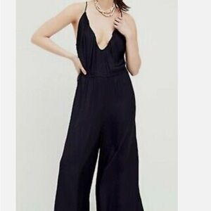 Free People black polka dot silky jumpsuit size medium